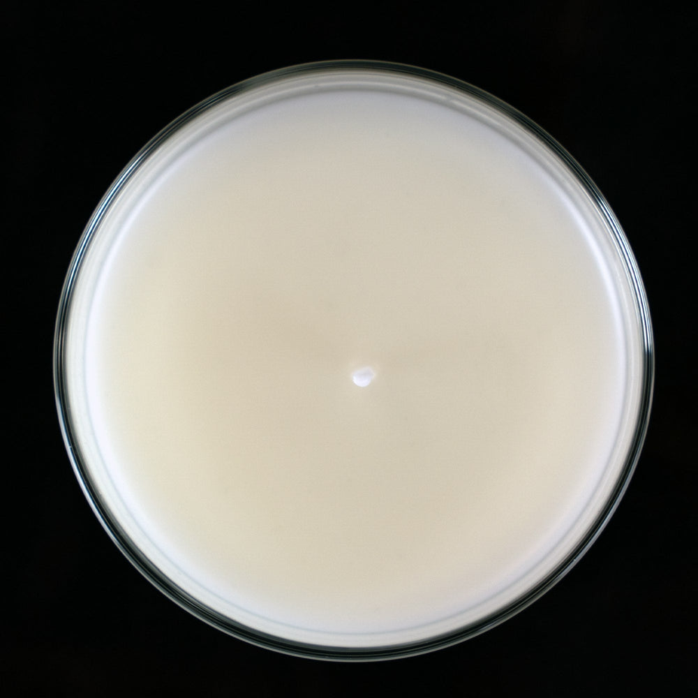 A top down view of a beautiful smooth surface on a paraffin candle. Paraffin, home made candle.