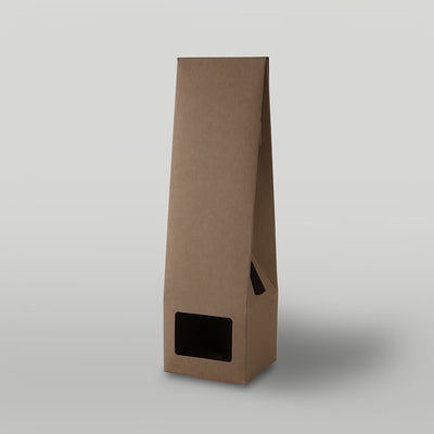 Brown candle packaging on a light grey background