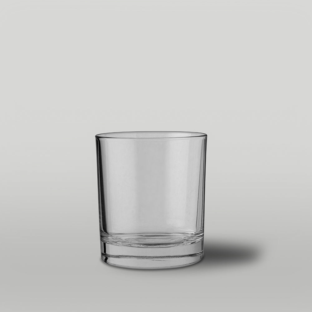 Clear glass Lotti candle jar on a light gray background