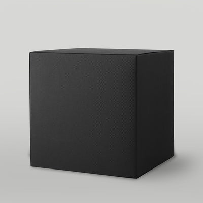 Black textured candle box on a light grey background
