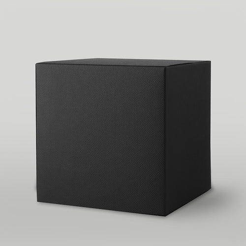 Black textured candle box on a light grey background
