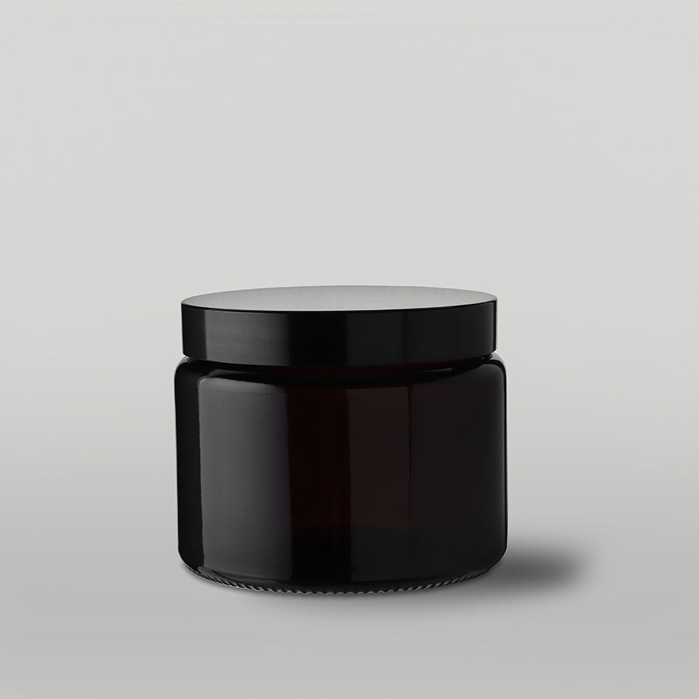 Amber 40cl apothecary candle jar on a grey background