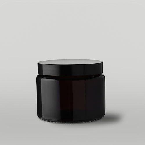 Amber 40cl apothecary candle jar on a grey background