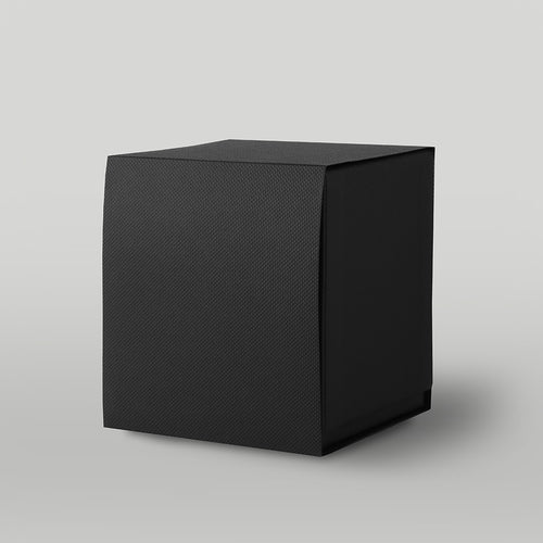 Black textured candle box on a light grey background