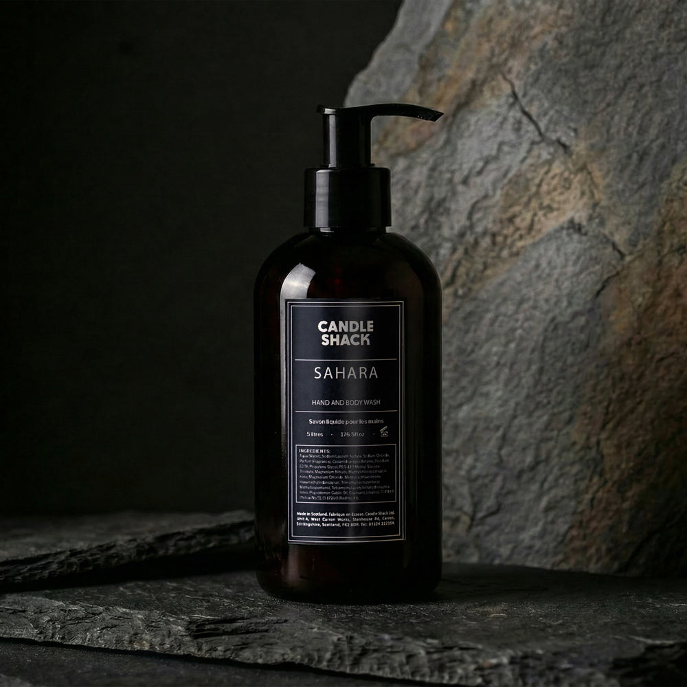 Black bottle hand and body wash of Sahara hand and body wash from Candle Shack on a dark background