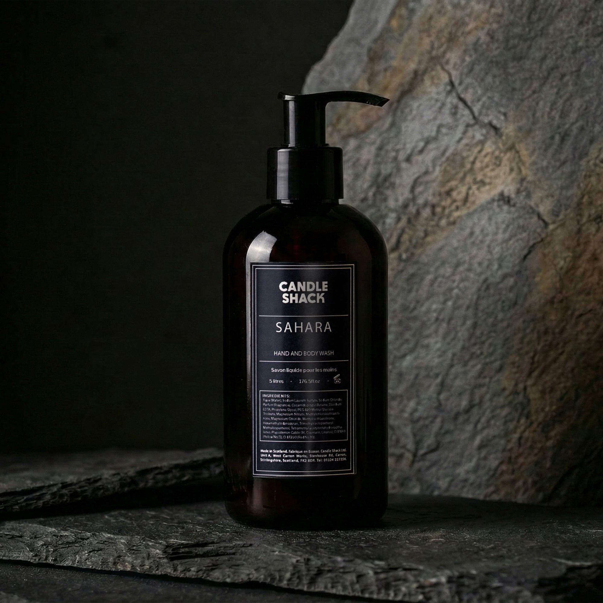 Black bottle hand and body wash of Sahara hand and body wash from Candle Shack on a dark background