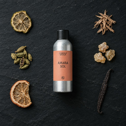 Amara Sol fragrance oil - Candle Shack aluminium bottle with dried botanicals on a dark slate background