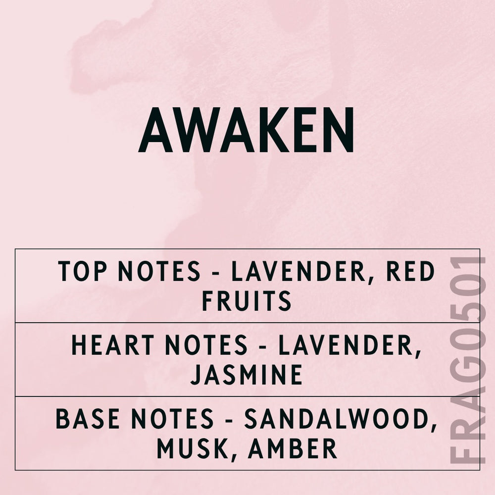 Awaken fragrance oil - Candle Shack aluminium bottle with dried botanicals on a dark slate background