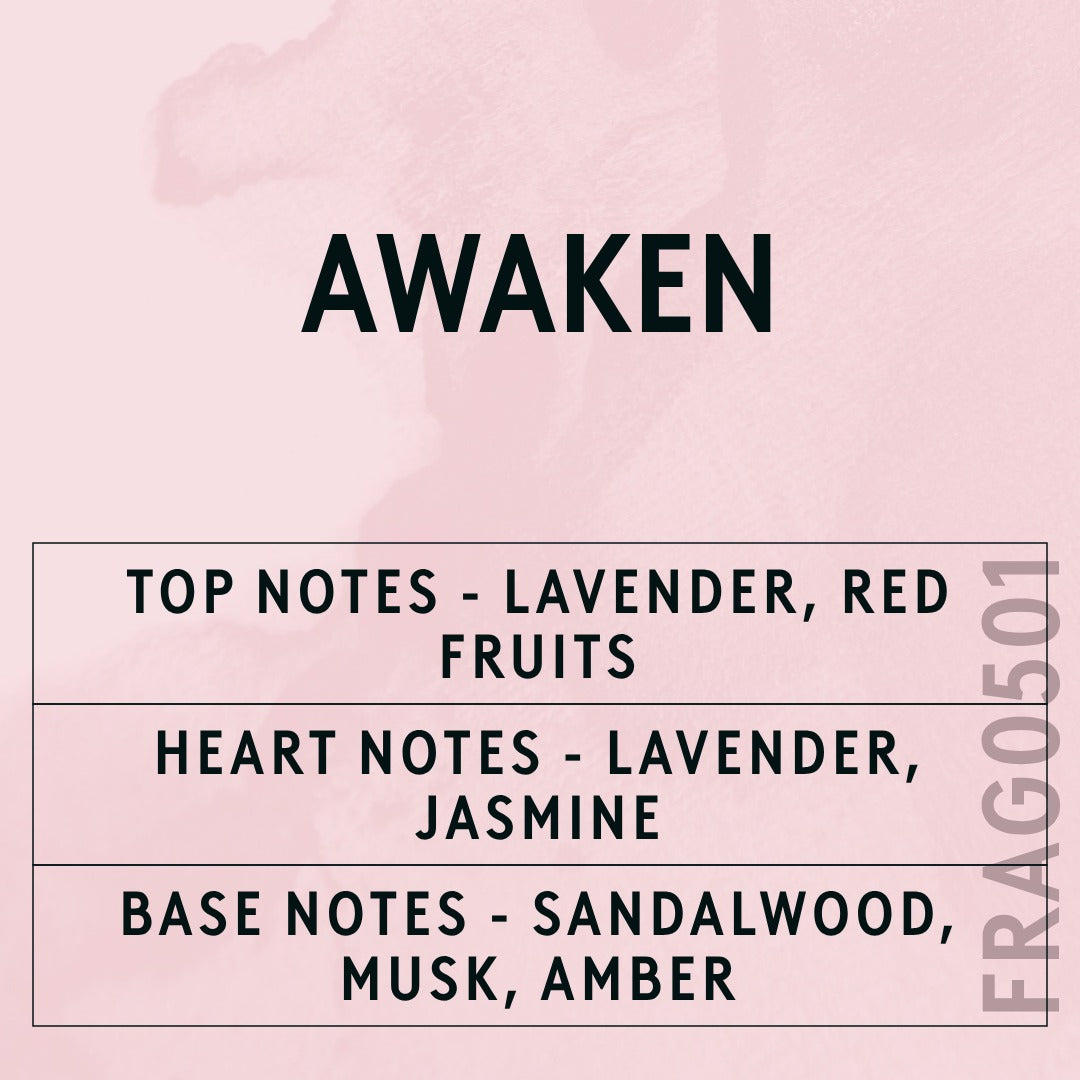 Awaken fragrance oil - Candle Shack aluminium bottle with dried botanicals on a dark slate background