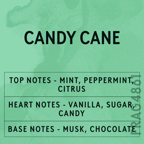 Candy Cane fragrance oil - Candle Shack aluminium bottle with dried botanicals on a dark slate background