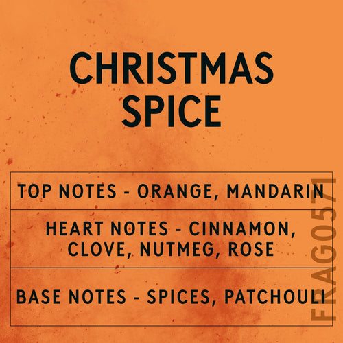Christmas Spice fragrance oil - Candle Shack aluminium bottle with dried botanicals on a dark slate background
