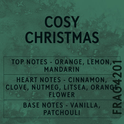 Cosy Christmas fragrance oil - Candle Shack aluminium bottle with dried botanicals on a dark slate background