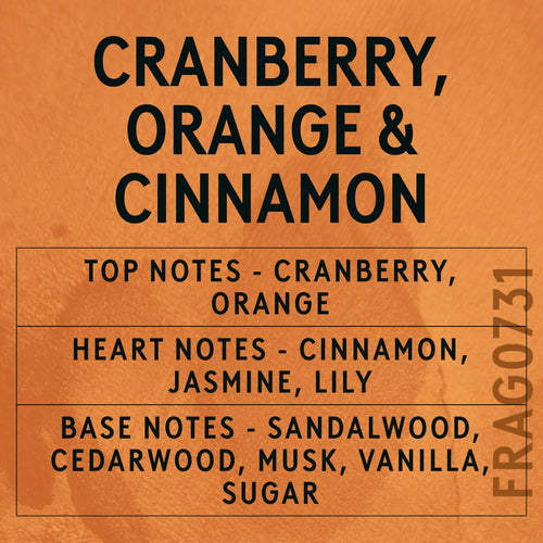 Cranberry, Orange and Cinnamon fragrance oil - Candle Shack aluminium bottle with dried botanicals on a dark slate background