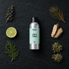 Gin And Tonic fragrance oil - Candle Shack aluminium bottle with dried botanicals on a dark slate background