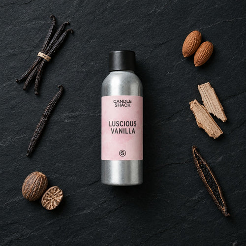 Luscious Vanilla fragrance oil - Candle Shack aluminium bottle with dried botanicals on a dark slate background