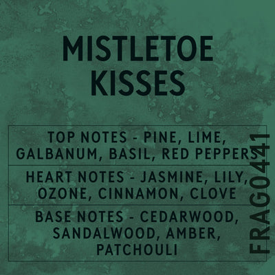 Mistletoe Kisses fragrance oil - Candle Shack aluminium bottle with dried botanicals on a dark slate background