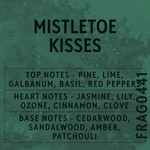 Mistletoe Kisses fragrance oil - Candle Shack aluminium bottle with dried botanicals on a dark slate background