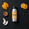 Passionfruit & Mango fragrance oil - Candle Shack aluminium bottle with dried botanicals on a dark slate background