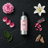 Peony fragrance oil - Candle Shack aluminium bottle with dried botanicals on a dark slate background