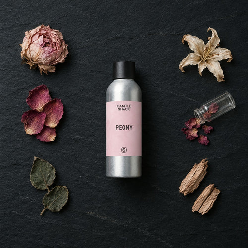 Peony fragrance oil - Candle Shack aluminium bottle with dried botanicals on a dark slate background