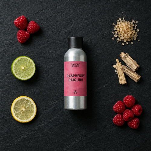 Raspberry Daiquiri fragrance oil - Candle Shack aluminium bottle with dried botanicals on a dark slate background