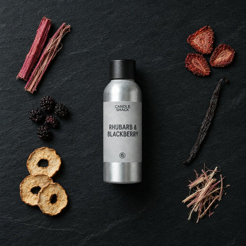 Rhubarb & Blackberry fragrance oil - Candle Shack aluminium bottle with dried botanicals on a dark slate background