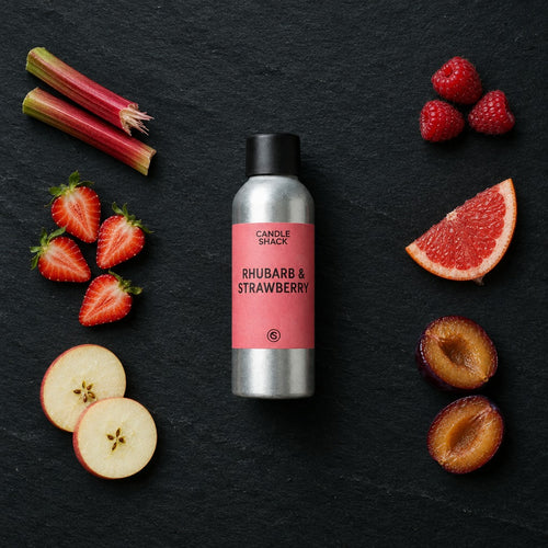 Rhubarb & Strawberry fragrance oil - Candle Shack aluminium bottle with dried botanicals on a dark slate background