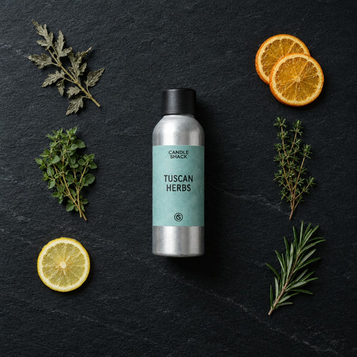 Tuscan Herbs fragrance oil - Candle Shack aluminium bottle with dried botanicals on a dark slate background
