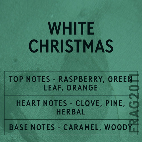 White Christmas fragrance oil - Candle Shack aluminium bottle with dried botanicals on a dark slate background
