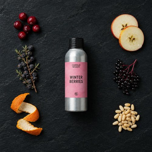 Winter Berries fragrance oil - Candle Shack aluminium bottle with dried botanicals on a dark slate background