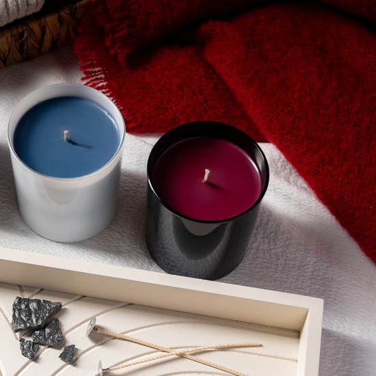 coloured candles on white and red blankets