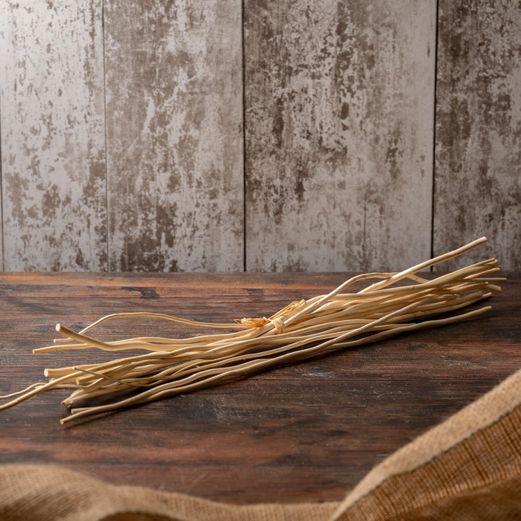 400mm long natural willow diffuser reeds on a wooden surface.